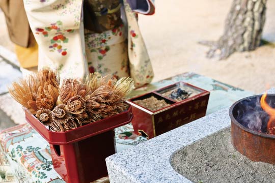 Place incense and whisks to the fire. Watch them burn while thanking them for their services with hands together.