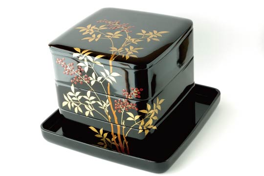 Jubako (重箱) is a nest of square-shaped lacquered boxes. The traditional material is wood.