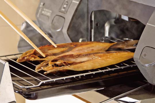 A built-in fish grill in a Japanese kitchen: It is made long and flat to bake fish.