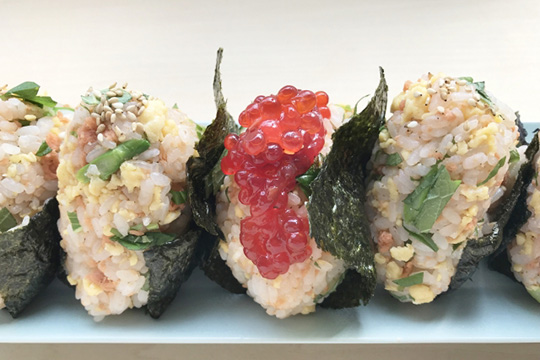 Gourmet onigiri overflowing with bold flavors.